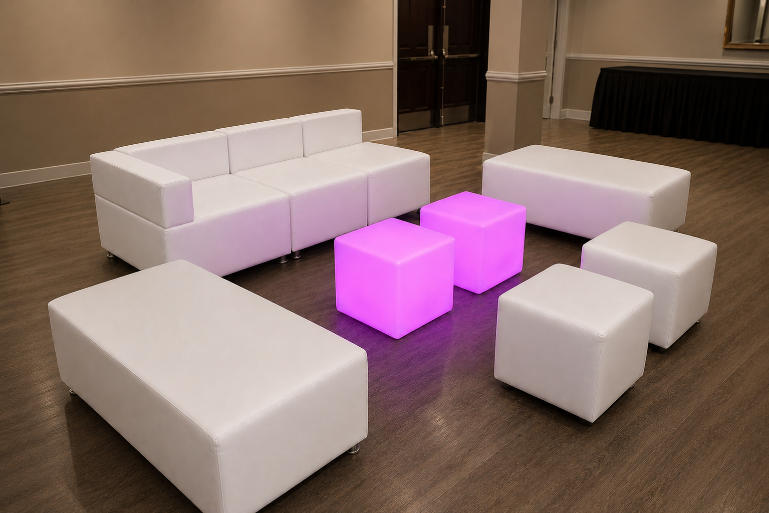White modular sofa and glowing LED cubes in a ballroom lounge